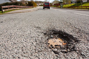 Cost to fix pothole-ridden local roads £10.24bn image