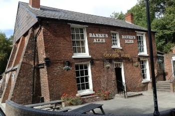 Crooked House owners ordered to rebuild pub image