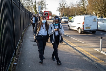 Government told to reconsider plans to stop face mask requirement in school image